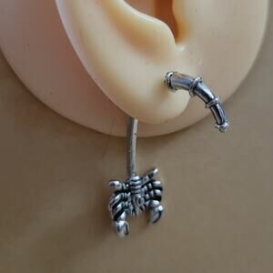 Scorpion through ear illusion earrings